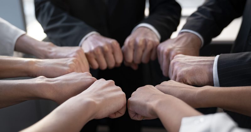 close-up-people-working-as-team-scaled.jpg
