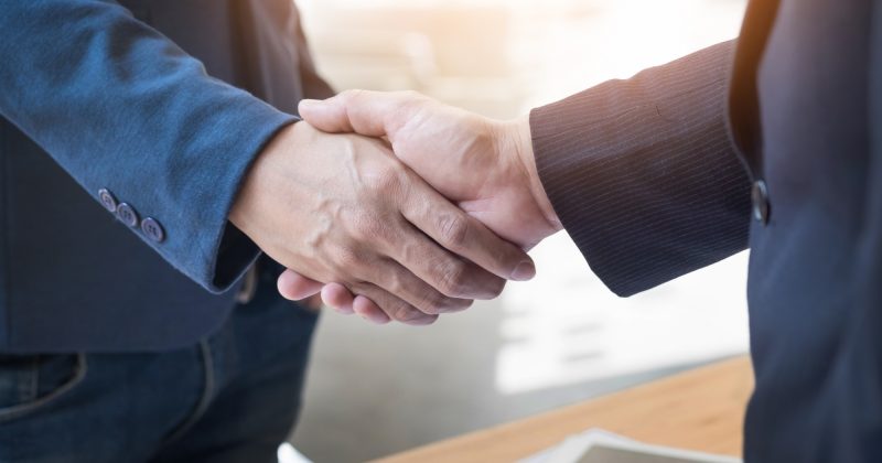 two-confident-business-man-shaking-hands-meeting-office-success-dealing-greeting-partner-concept.jpg